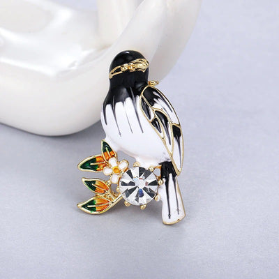 Cute Critters Brooch - Songbird - An adorable little bird perched on a sprig of flowers, adorned with brightly-coloured enamel and crystals. Available in green, blue, or black and white.
