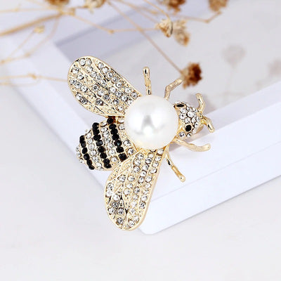 Queen Bee Brooch - A lovely rhinestone brooch shaped like a honeybee, and adorned with a large pearl. Available in gold or silver, with white or gold coloured pearls.