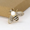 Queen Bee Brooch - A lovely rhinestone brooch shaped like a honeybee, and adorned with a large pearl. Available in gold or silver, with white or gold coloured pearls.