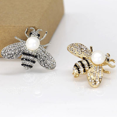 Queen Bee Brooch - A lovely rhinestone brooch shaped like a honeybee, and adorned with a large pearl. Available in gold or silver, with white or gold coloured pearls.