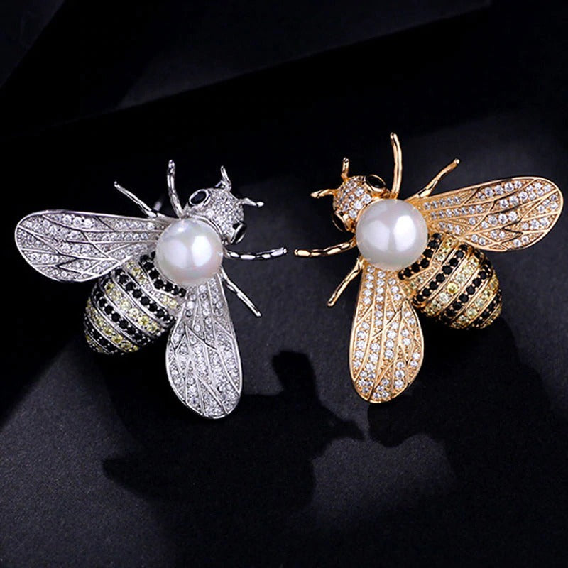 Queen Bee Deluxe Brooch - A beautiful bee brooch set with dozens of delicate crystals and a large pearl, available in gold or silver.