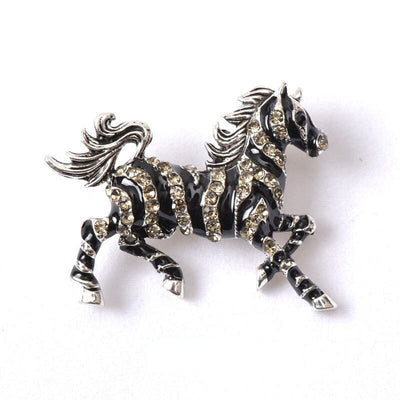 Zesty Zebra Brooch - A medium sized brooch shaped like a zebra running with its mane and tail flowing in the wind. It's available in gold or silver colours, and is studded with crystals.