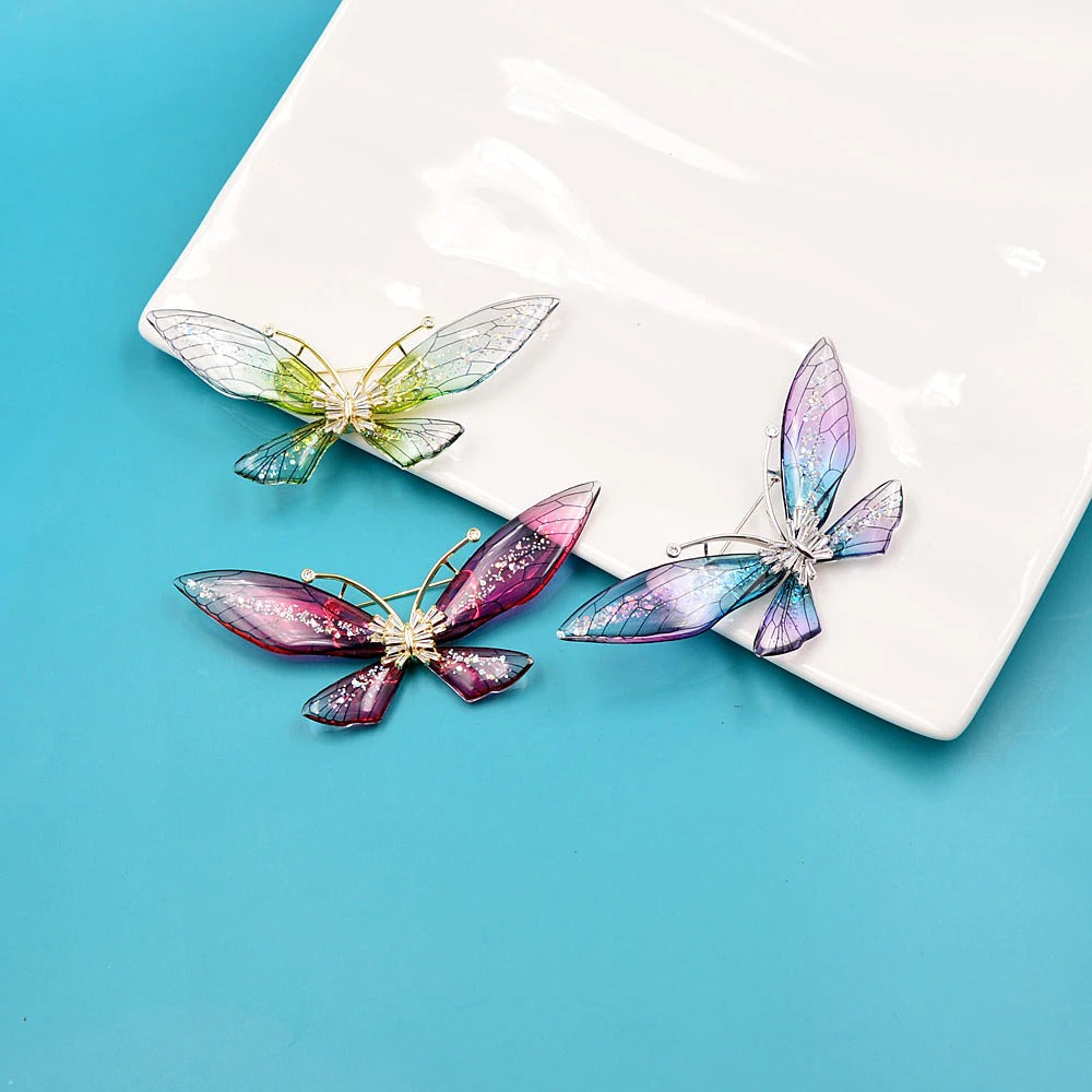 Magnifique Butterfly Brooch - A large, elegant resin brooch adorned with glitter and crystals, available in three lovely translucent colour palettes. 