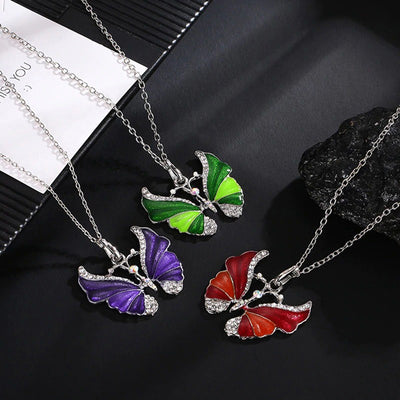 The Adonis Butterfly Necklace - Beautiful medium length silver coloured necklaces with butterfly pendants in blue, green, red, pink, purple, and honey orange gold.