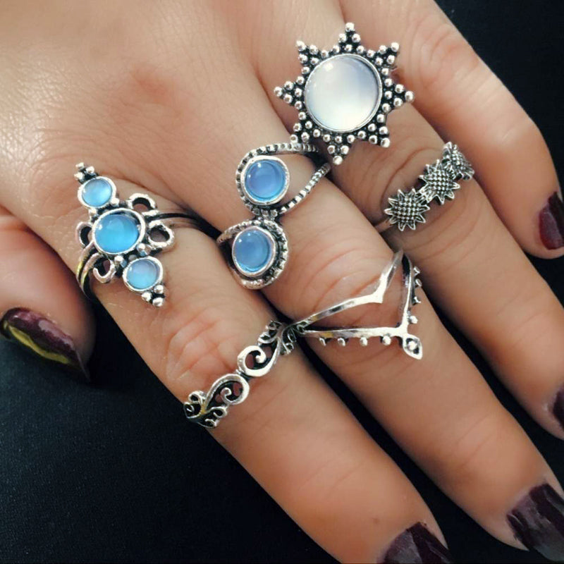 The Apollo Ring Set - A set of six silver rings with a sun-and-moon motif punctuated by beautiful artificial moonstones. 