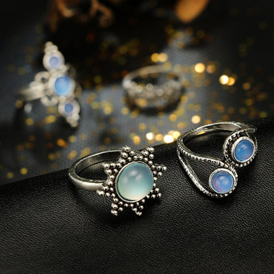 The Apollo Ring Set - A set of six silver rings with a sun-and-moon motif punctuated by beautiful artificial moonstones.