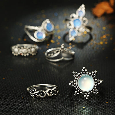 The Apollo Ring Set - A set of six silver rings with a sun-and-moon motif punctuated by beautiful artificial moonstones.