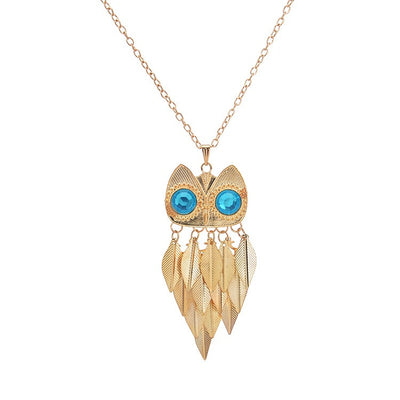 Athena Sweater Chain - A long golden chain with a stylised owl-themed pendant strung on it.