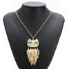 Athena Sweater Chain - A long golden chain with a stylised owl-themed pendant strung on it.