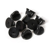 Loose Brooch Pin Backs - A pile of rubber brooch backs in black.