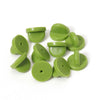 Loose Brooch Pin Backs - A pile of rubber brooch backs in green.