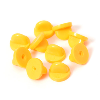 Loose Brooch Pin Backs - A pile of rubber brooch backs in yellow.