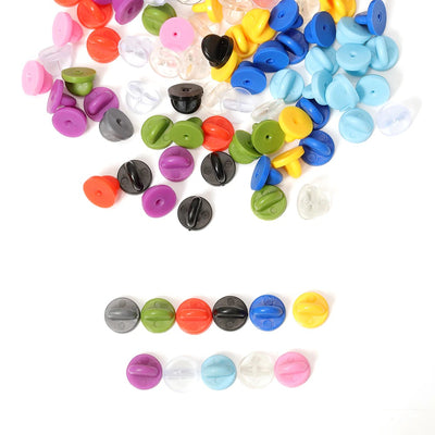 Loose Brooch Pin Backs - A large pile of rubber brooch backs in mixed colours.