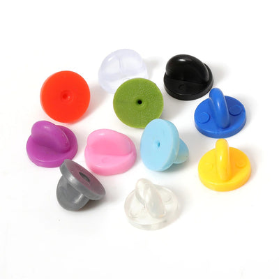 Loose Brooch Pin Backs - A large pile of rubber brooch backs in mixed colours.