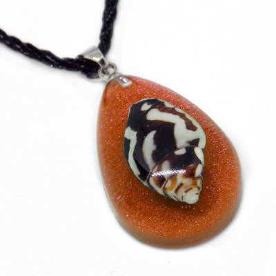 Calypso's Tear Necklace - A teardrop-shaped resin necklace featuring a tiny little seashell trapped in coloured amber, strung on a surfer-style leatherette necklace.