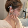 Cara Butterfly Ear Cuff - A large, sparkly earring designed to sit over the wearer's ear without needing any piercings.