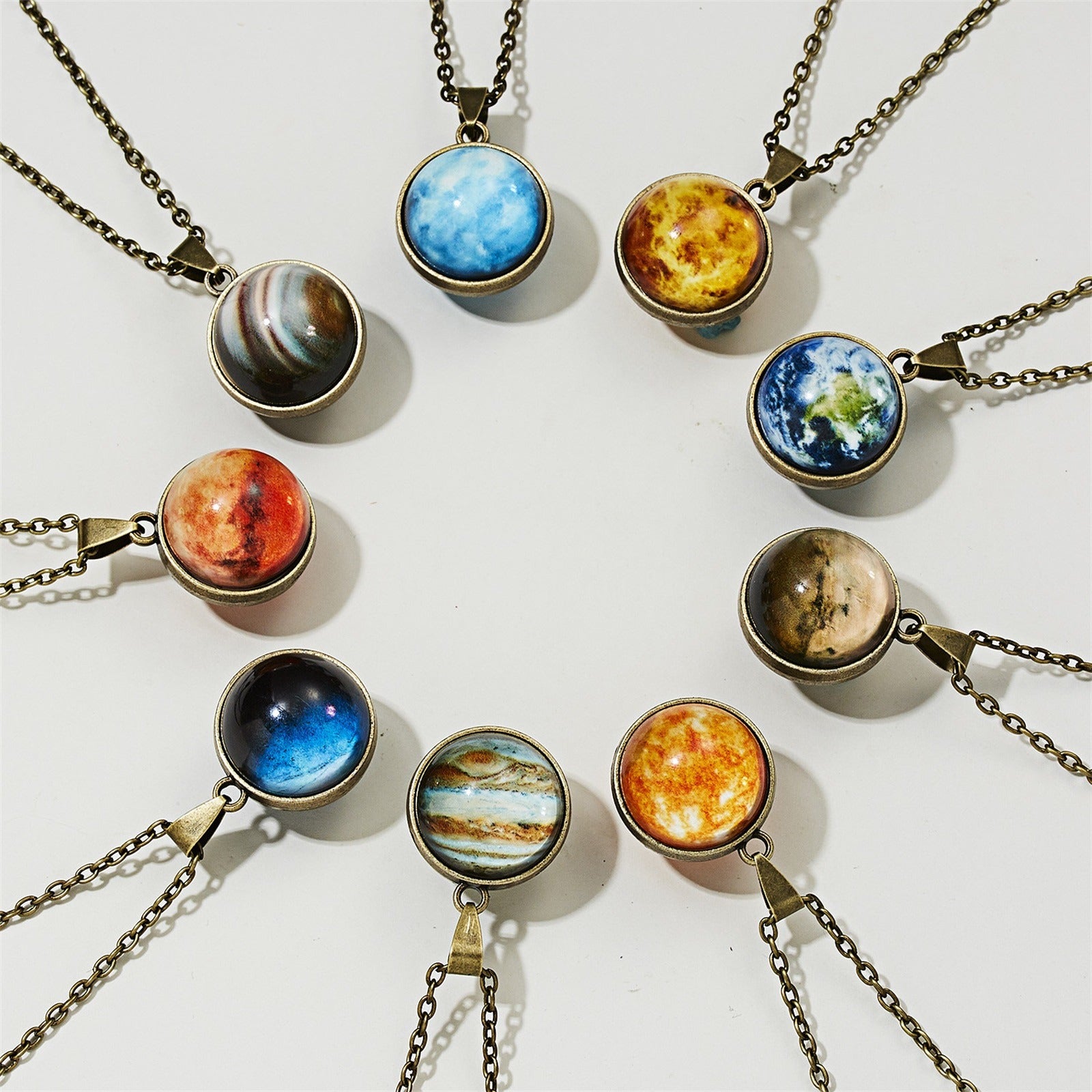 Cheeky Geek Stargazer Glow-In-The-Dark Planet Pendant - Small round glass pendants with images of different planets in the middle, which glow in the dark.