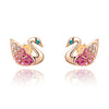 Swan Stud Earrings - Small, delicate swan-shaped earrings in rose gold or white gold, with tiny crystals adorning the wings and eyes.