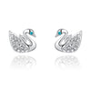 Swan Stud Earrings - Small, delicate swan-shaped earrings in rose gold or white gold, with tiny crystals adorning the wings and eyes.