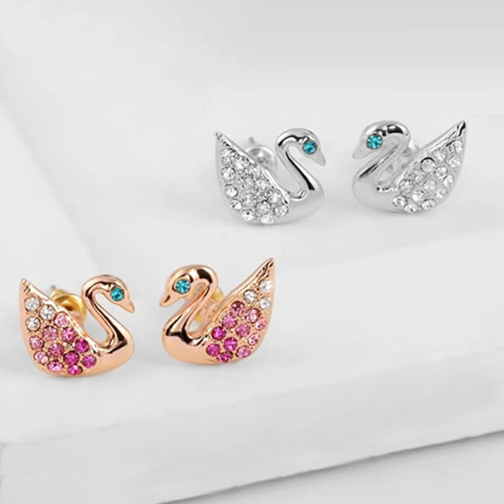 Swan Stud Earrings - Small, delicate swan-shaped earrings in rose gold or white gold, with tiny crystals adorning the wings and eyes.
