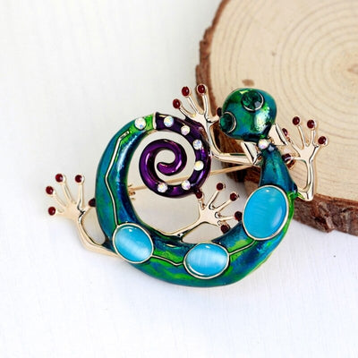 Cute Critters Brooch - Green Gecko - A large enamel brooch shaped like a curled gecko, in vibrant shades of green, blue, and purple.