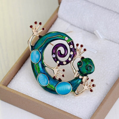 Cute Critters Brooch - Green Gecko - A large enamel brooch shaped like a curled gecko, in vibrant shades of green, blue, and purple.