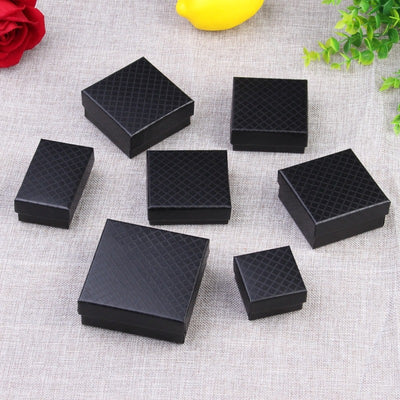 Diamond Embossed Jewellery Gift Box - An assortment of different sized gift boxes, which are made of black paper with a diamond lattice print embossed into it.