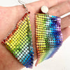 The Diva Drape Earrings: Pride Edition - Large shiny aluminium mesh earrings with a rainbow colour scheme.