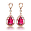 Elise Luxury Crystal Dangle Earrings - Gorgeous, high-class vintage-style drop earrings with a large pear-shaped red topaz surrounded by tiny quartz crystals.
