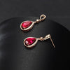 Elise Luxury Crystal Dangle Earrings - Gorgeous, high-class vintage-style drop earrings with a large pear-shaped red topaz surrounded by tiny quartz crystals.