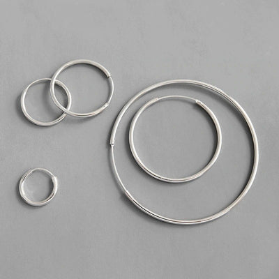 Essentials 925 Sterling Silver Hoop Earrings - Beautiful sterling silver hoop earrings, available in your choice of sizes.  Available in:  10mm, 15mm, 20mm, 30mm, 40mm, 50mm, and 70mm. Snag a shiny silver bargain!