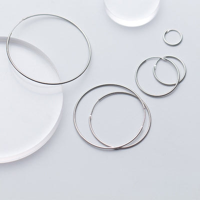 Essentials 925 Sterling Silver Hoop Earrings - Beautiful sterling silver hoop earrings, available in your choice of sizes.  Available in:  10mm, 15mm, 20mm, 30mm, 40mm, 50mm, and 70mm. Snag a shiny silver bargain!