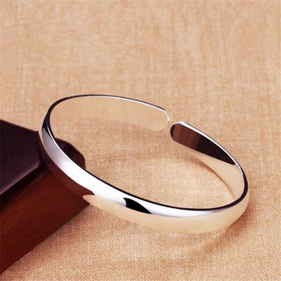 Essentials 925 Sterling Silver Plated Cuff Bangle - A very simple plain silver cuff bangle, which can be adjusted to fit the wearer's wrist.
