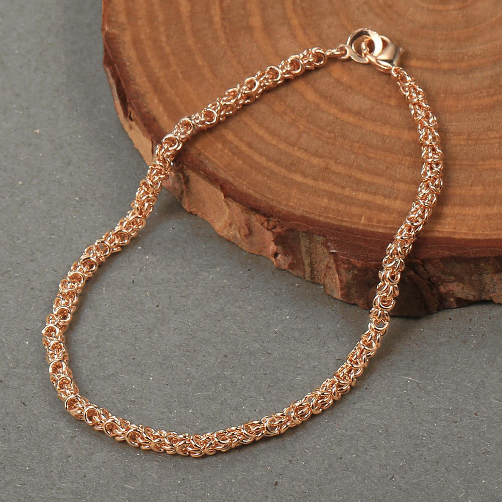 Eudocia Byzantine Weave Bracelet - A delicate rose gold bracelet made from a complicated weave of interlocking rings.