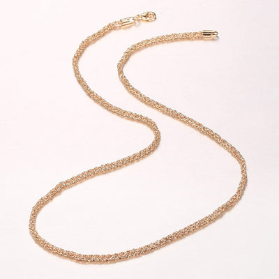 Eudocia Byzantine Weave Necklace - A delicate rose gold necklace made from a complicated weave of interlocking rings.