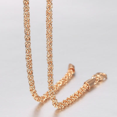 Eudocia Byzantine Weave Necklace - A delicate rose gold necklace made from a complicated weave of interlocking rings.