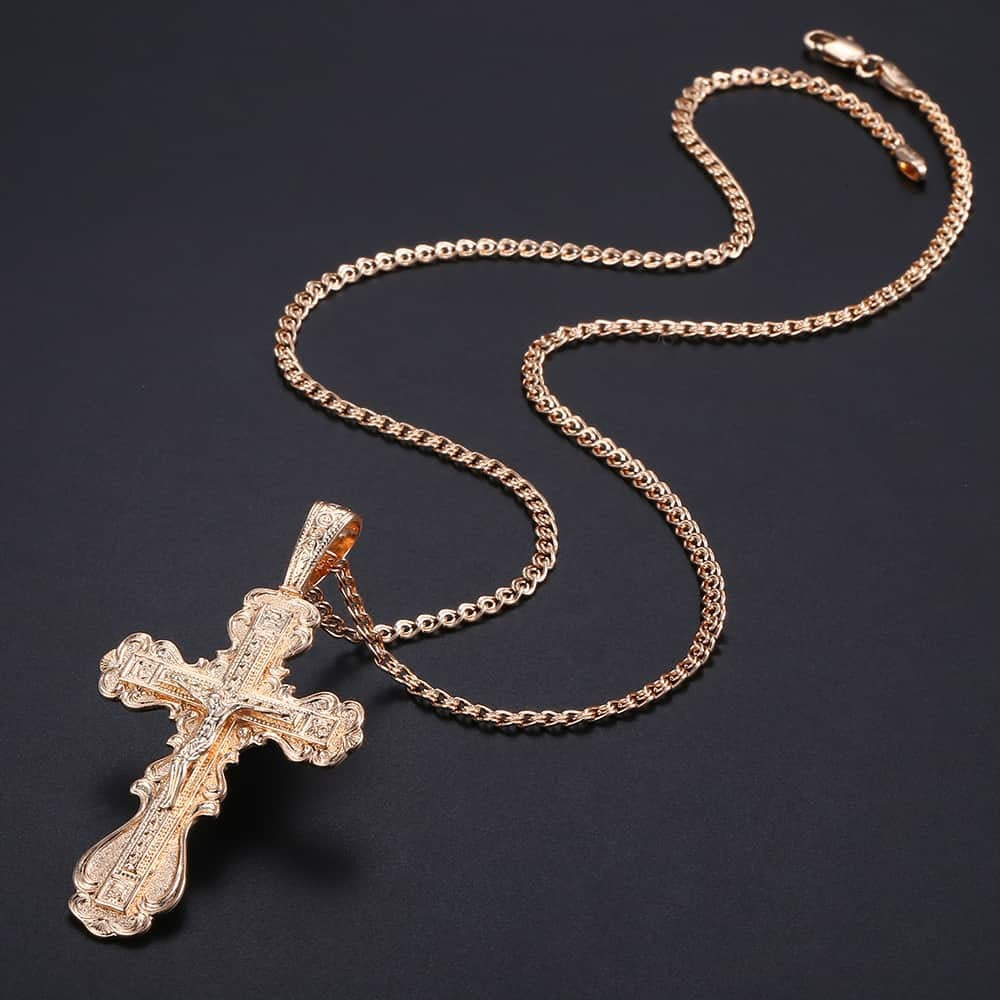 Faith Oversized Ornate Crucifix Necklace - A large, ornately carved rose gold cross on a slim chain. 