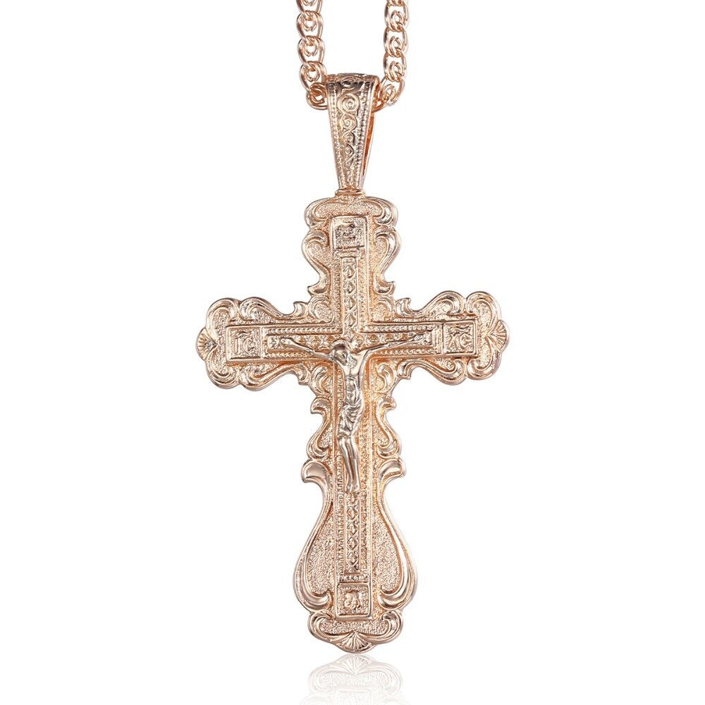 Faith Oversized Ornate Crucifix Necklace - A large, ornately carved rose gold cross on a slim chain.