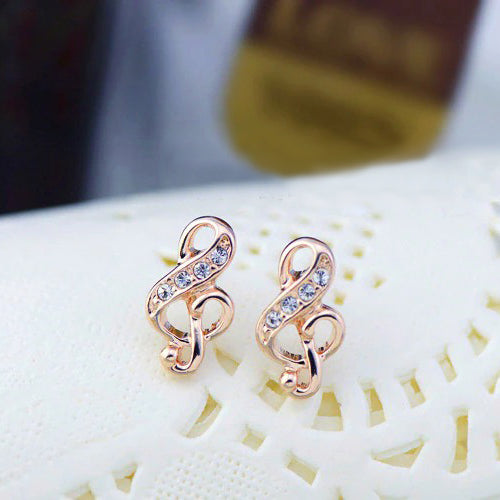 Florence Treble Clef Stud Earrings - Tiny, adorable stud earrings shaped like musical notes, studded with small gemstones.