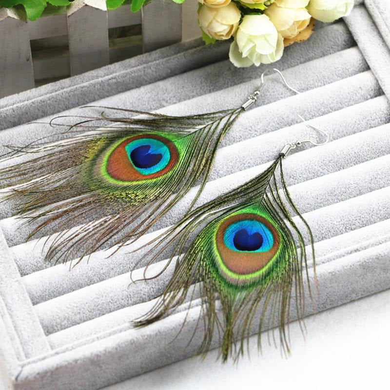 Hera Peacock Feather Earrings - Large, elegant peacock feather earrings suspended from a simple, low-allergy steel french hook.