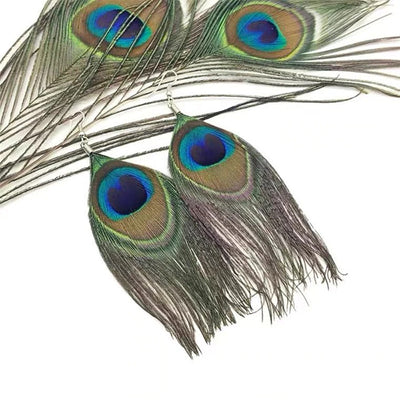 Hera Peacock Feather Earrings - Large, elegant peacock feather earrings suspended from a simple, low-allergy steel french hook.