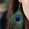 Hera Peacock Feather Earrings - Large, elegant peacock feather earrings suspended from a simple, low-allergy steel french hook.