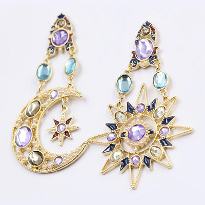 The Hypatia Earrings - A large, gold-coloured pair of earrings studded with artificial crystals, in a beautiful star and moon motif.