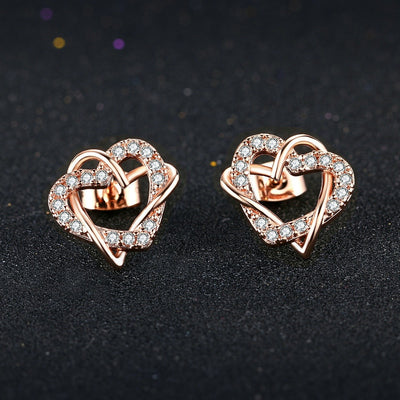 Inseparable Earrings - Delicate stud earrings featuring a pair of inseparably intertwined hearts encrusted with small gems.