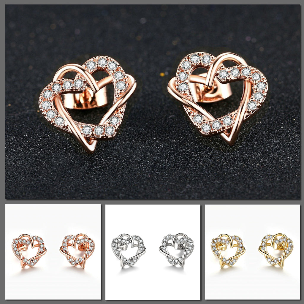 Inseparable Earrings - Delicate stud earrings featuring a pair of inseparably intertwined hearts encrusted with small gems. 