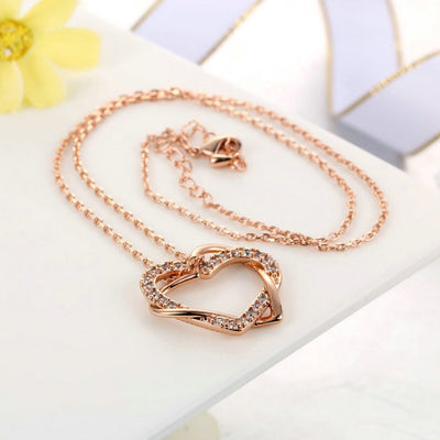 The Inseparable Pendant - A lovely heart-shaped crystal necklace on a standard link chain. Available in rose gold, platinum, or yellow gold colour.