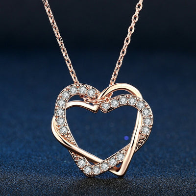 The Inseparable Pendant - A lovely heart-shaped crystal necklace on a standard link chain. Available in rose gold, platinum, or yellow gold colour.