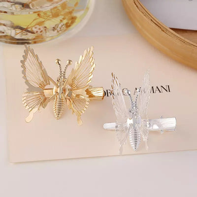 Kimana Fluttering Butterfly Hair Clips - Cute metal butterfly clips with spring-loaded wings that flutter constantly with the slightest movement.