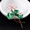Mika Enamel Lotus Brooch - A lovely colourful brooch with a green metallic lily pad, a flower constructed of marquise cut pink crystals, and delicate pave-style crystals along the underside of the leaf.