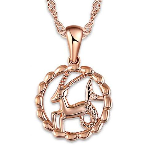 The Oracle Necklace - A super delicate rose gold pendant featuring various stylised representations of astrological star signs, suspended on a slim spiral chain necklace.